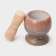 A mortar with a “marble” push, made of natural stone, brown color