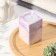 Candle "Square" in the candlestick of gypsum, 5x8cm, marble with purple strips