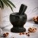 A mortar with a pestle made of stone is medium, 250 ml, black marble, in a box