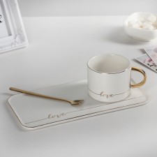 Tea couple ceramic with a spoon 