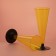 A plastic disposable “cone” plastic glass, 150-180 ml, 6 pcs in packaging, yellow color with a black leg