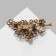 Brooch "Flowers" on a twig, the color emerald-radiant in black gold
