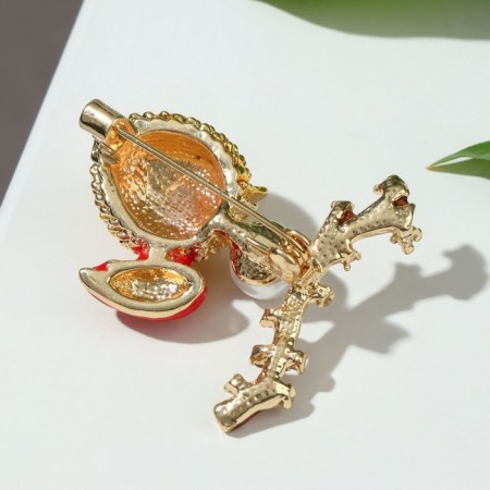 Brooch "Chick" on a branch, colored in gold-1