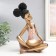 Polystone souvenir "Girl with curly tails, with a dish" pink-gold 17x12x27 cm