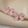 Earrings Metal "Bows" tape, pink color