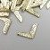 Protective corner for the album Metal "Curls" set 100 pcs gold 1.4x1.4 cm