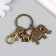Keychain metal with carbine "Elephants" bronze 6.5 cm