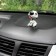 Dog on a car panel shocking his head, Dalmatian