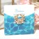 Clutch for the scarf "Pearl inflorescence", the color is white in gold