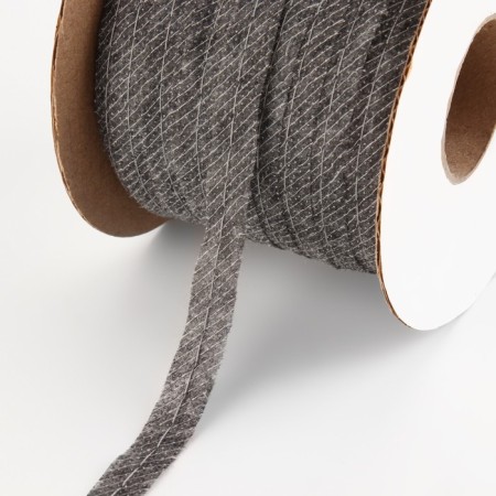 Non -woven tape, threaded, reinforced, 10 mm, 100 m, gray color.