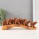 Polystone souvenir "Seven elephants on a tusk" under a tree 4.6x29x10 cm