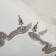 Hanging earrings with rhinestones "snake" curved, white color in silver, 5.7 cm