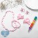 Set of children's "chosen" 6 items: 2 elastic bands, clips, beads, bracelet, felt -tip pen, kitten, color