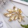 Brooch "Carved", white-green color in gold