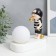 Souvenir Polystone Light "Baby in a black cap, with a gold bubble at the ball" 16.5x8x16 cm