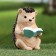 Garden figure "Hedgehog reads the book" 10x9x14cm