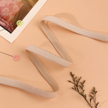 The elastic band is becoming, with an openwork edge, 10 mm, 10 ± 0.5 m, beige color