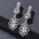 Clips "Openzer in rhinestones" Ellipse, white color in silver