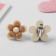 Clips children's “chosen” flower in a circle, color-brown color
