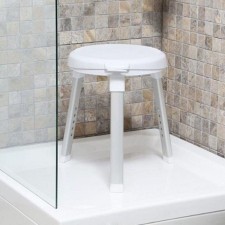 A bathroom chair with a rotary seat, white color