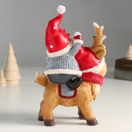 Suvenir Polystone "Santa Claus riding Oleska in a red cap and scarf" 8x14x23 cm-2