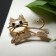 Brooch "cat" in a jump, white color in gold