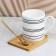 Ceramic mug on a wooden stand "Hide and Hide and Humanitudes", 330 ml, with a spoon, white color