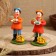 Dymkovo toy "Standing man with a chicken"