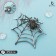 Brooch "Spider in the web", the color is black and white in silver