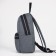 A backpack with a zipper, "saxi", outer pocket, gray color