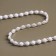 Pearls on threads, with holography, flat, 6 mm, 9 ± 1 m, white color