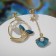 Emall Earms "Night" tail with a shell, the color is blue-white in gold