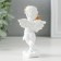 Polystone souvenir "Snowthrough angel with a cake decorated rose" 6x4.5x11 cm