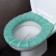 Soft cover on the lid and seat of the toilet (green)