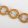 A chain for a bag, with carbines, wooden, d = 2.5/3 cm, 60 cm, brown/gold color
