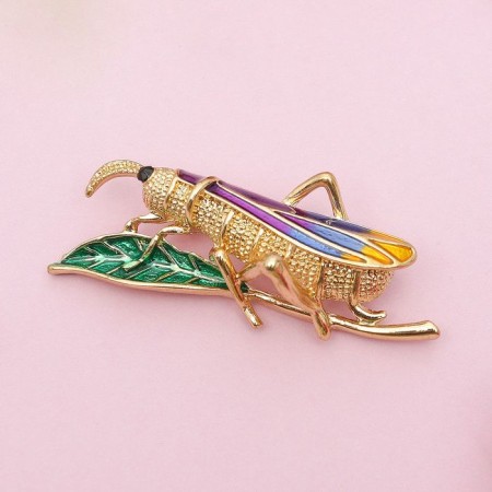 Brooch "grasshopper", colored in gold