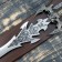 Souvenir sword on a tablet, carved blade, gold hilt with the head of a dragon