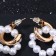 Earrings with the removable element "Transformer" two pearl rings, the color is white in gold