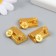 Polystone souvenir "Gold Eathes with coins" 2.5x1 cm