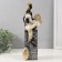 Polystone souvenir "African with a tambourine on a column with patterns" white-black, gold 10.5x9x32 cm 10325