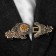 Cardigan clamp "Order", brown color in black gold