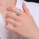 Ring Xuping Game of Light, white color in silver, size 18
