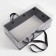 Gift box with a bow, handles and a transparent lid 35 x 21 x 15 cm black