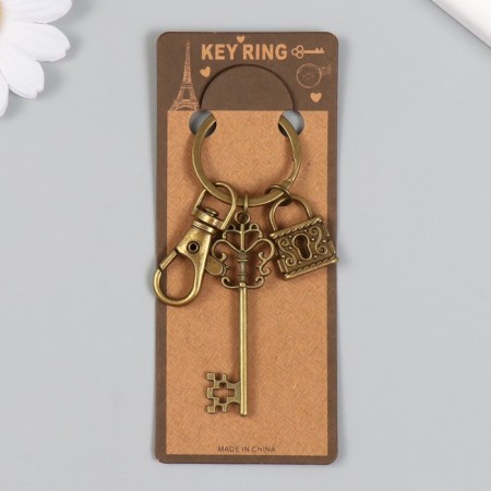 A metal keychain with a carbine "openwork key and a lock" bronze 8.6 cm-3