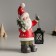 Ceramics Ceramics "Santa Claus in a red fur coat, with a flashlight and a Christmas tree" 15.5x9x30 cm