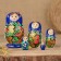 Matryoshka "God's cow", blue dress, 5 puppet, 9-10 cm