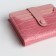 Women's wallet on the button, pink color