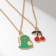 Set 2 pendants "lean" cherries and a dinosaur, colored in gold, 40 cm