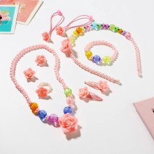 The kit of children's “chosen” 9 objects: rim, 2 elastic bands, 2 hairpins, clips, pendants, bracelet, ring, roses, color mix