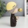 Souvenir Polystone "A boy in a gold baseball cap with a rose and gold bubble" 12x6x8 cm